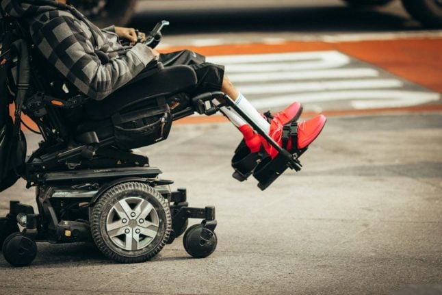 Pictured is a wheelchair user.