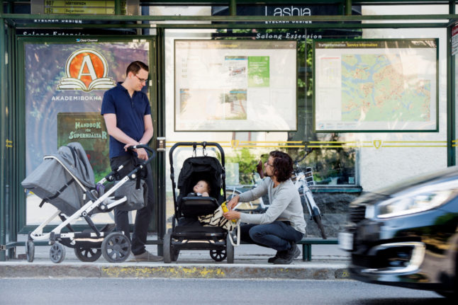 two fathers with babies in strollers