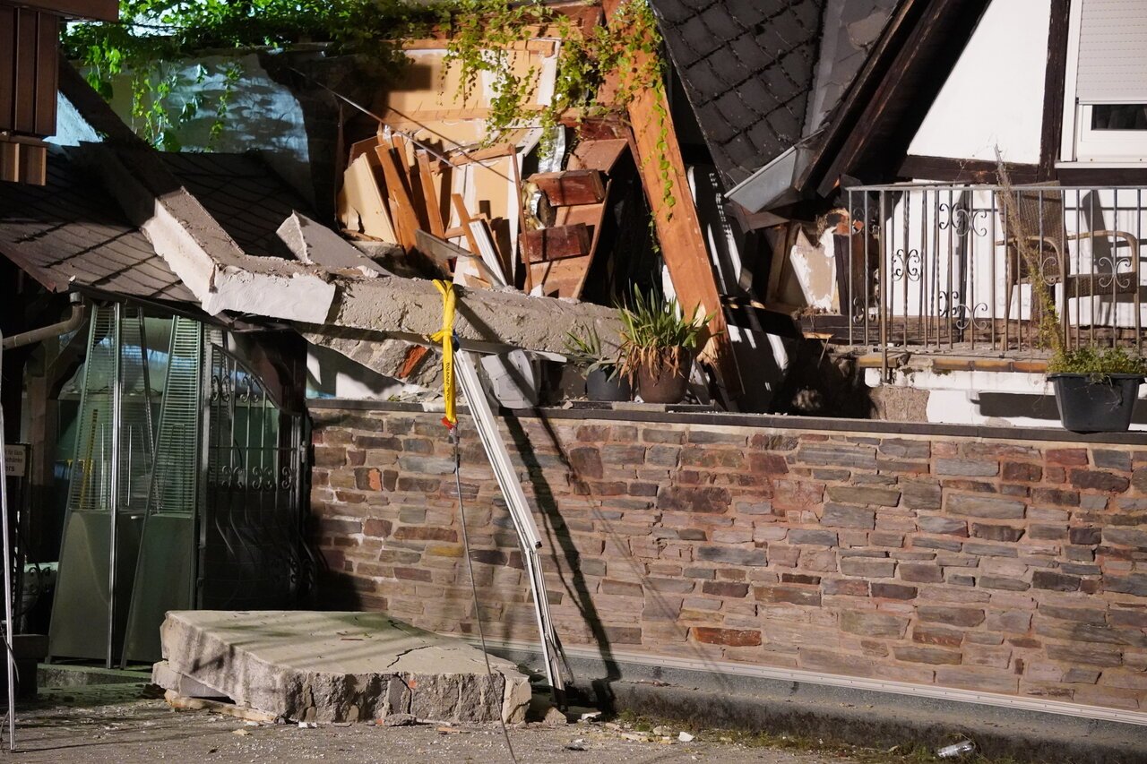 Damage to the hotel can be seen.