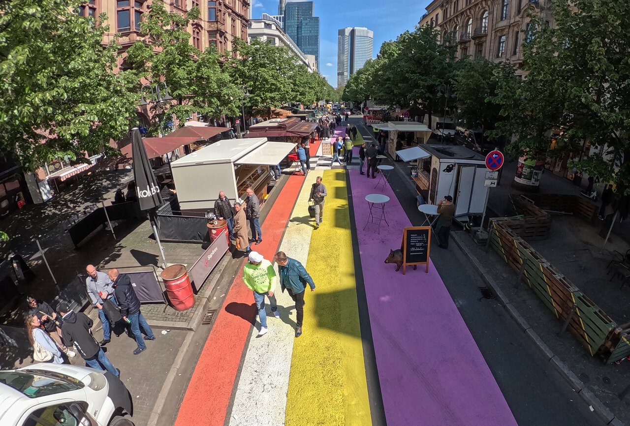 Colorful arrows along the asphalt of Kaiserstrasse in the Bahnhofsviertel district of Frankfurt am Main installed to help visitors navigate the city during Euro 2024.