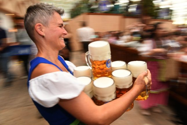 Wiesn server Kati carrying beers at the festival in 2023.