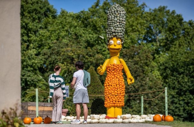 Visitors look at the Marge Simpson artwork by artist Pit Ruge as part of the 25th pumpkin exhibition in Ludwigsburg.