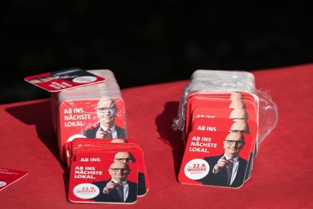 Beer mats with a picture of state premier Dietmar Woidke with the phrase ‘Off to the next polling station’ during the SPD's election campaign closing at the Möwe water sports club in Brandenburg.