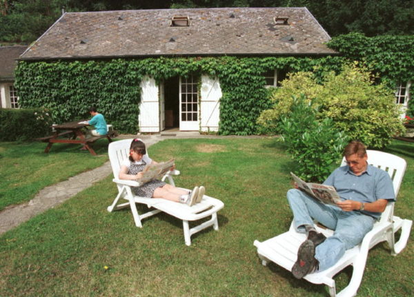 A family relaxing on holiday at a gite in Normandy