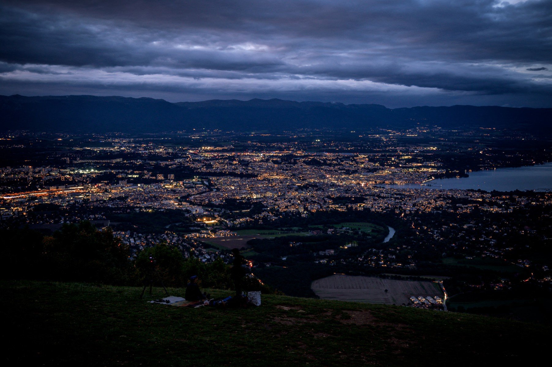 This photograph taken from the Saleve mountain in Monnetier-Mornex, France, shows the Greater Geneva urban agglomeration that extends the Swiss Canton of Geneva, the district of Nyon and parts of the French departments of Haute-Savoie and Ain around the city of Geneva with its public lighting off. More than 150 Swiss and French municipalities of the Greater Geneva have switched off their street lighting on September 26, 2019 to raise awareness about impact of light pollution during and action called: The night is beautiful (La nuit est belle)