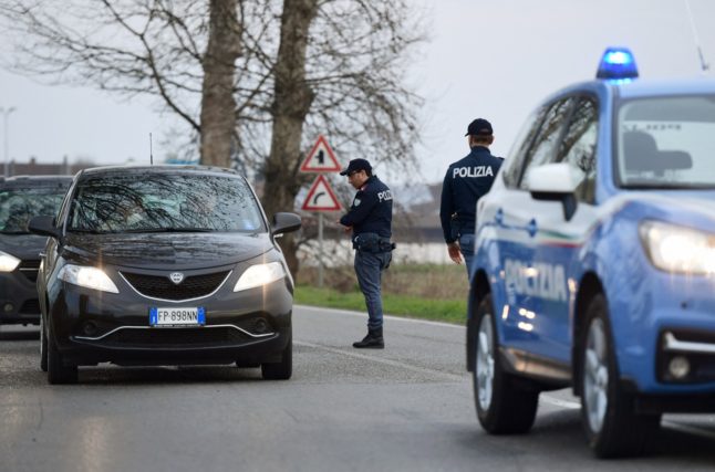 talian police officers pictured after stopping a car