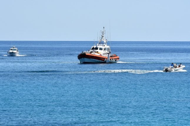 File photo of an Italian coast guard boat entering the harbour of Lampedusa