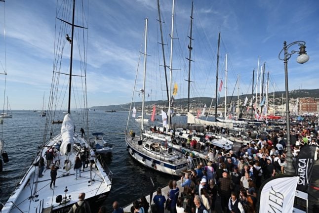 Boat crews on a pier in the port of Trieste on a day prior to the 54th Barcolana regatta