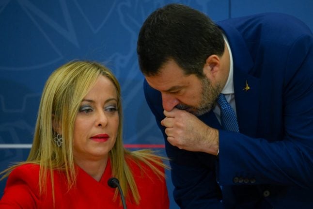 Italy's Deputy Prime Minister Matteo Salvini speaks to Prime Minister Giorgia Meloni during a press conference in November 2022 in Rome