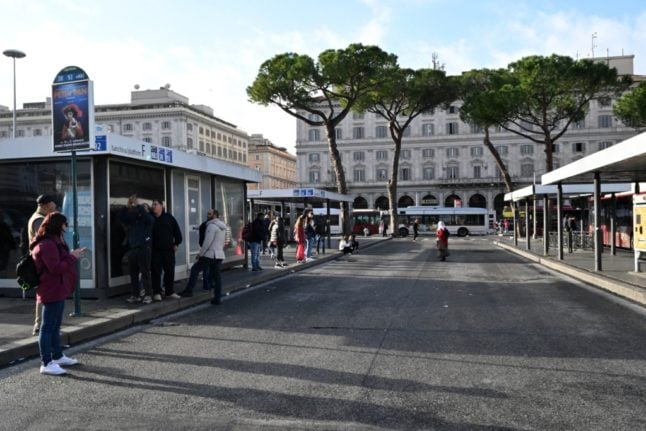 Passengers wait for a bus at the Rome Termini station during a nationwide strike in November 2023