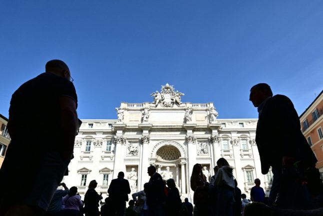 Tourists pictured in front of Rome's Trevi Fountain in March 2024