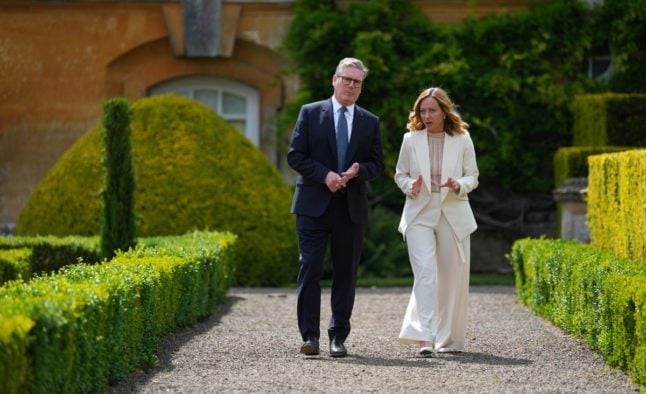 British Prime Minister Keir Starmer talks with Italy's Prime Minister Giorgia Meloni during a UK bilateral meeting at Blenheim Palace in Woodstock, southern England, in July 2024