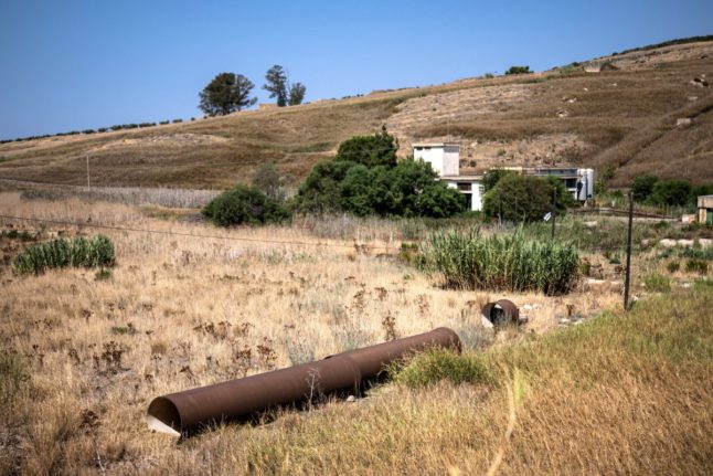 A rusty water pipe from the Trinita dam, in Castelvetrano, southwest Sicily, in August 2024