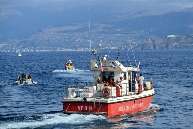 Rescue teams are pictured operating off Porticello harbour near Palermo, where they were searching for missing people after the British-flagged luxury yacht Bayesian sank in August