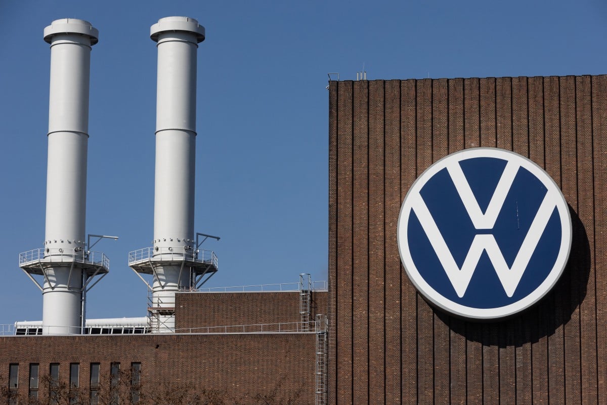 The logo of German carmaker Volkswagen (VW) is pictured on the main plant of the group in Wolfsburg, northern Germany, on March 22, 2022. Photo by Yann Schreiber / AFP