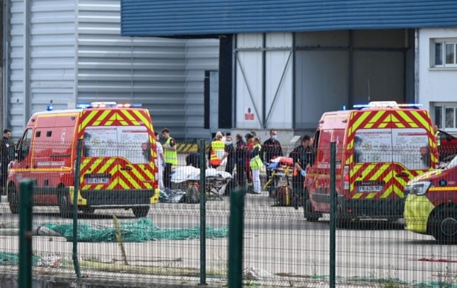 Emergency services in France with the bodies of migrants who died trying to cross the Channel to England in Boulogne-sur-Mer