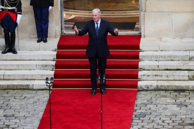 New France PM Barnier promises 'change' as he takes office