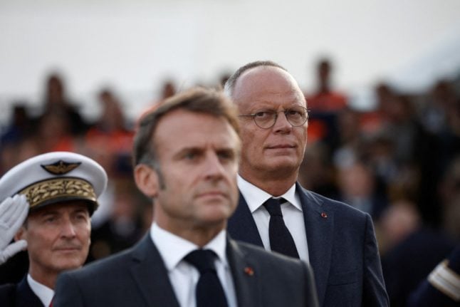 Mayor of Le Havre Edouard Philippe looks towards France's President Emmanuel Macron during a ceremony commemorating the 80th anniversary of the port's liberation