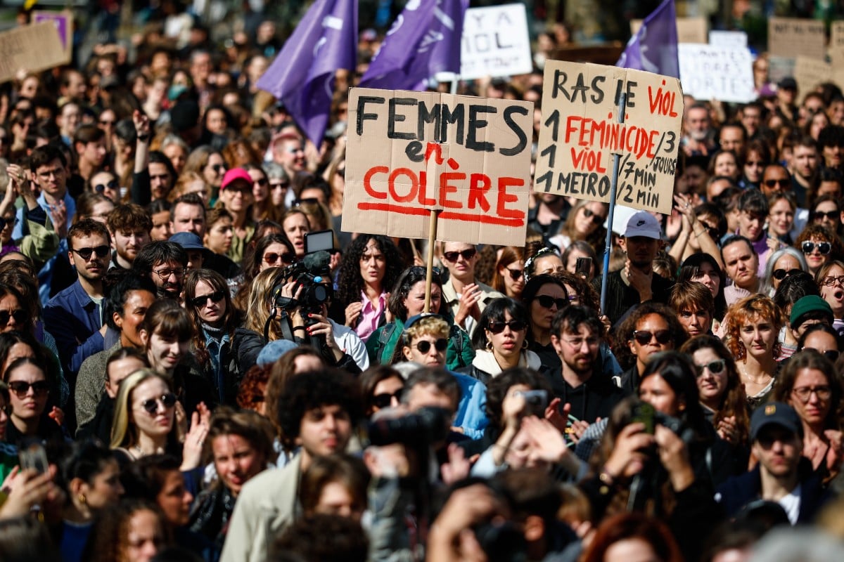 A placard which reads "Angry Women" is displayed as protesters take part in a demonstration in support of Gisele Pelicot in Paris 