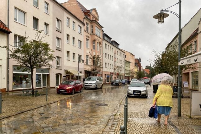 A woman walks along the high street in Spremberg.