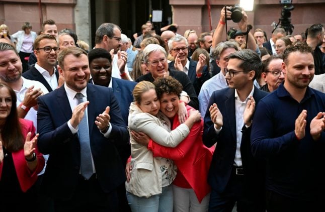 SPD party members and supporters celebrate the exit polls in Potsdam, eastern Germany on September 22, 2024.