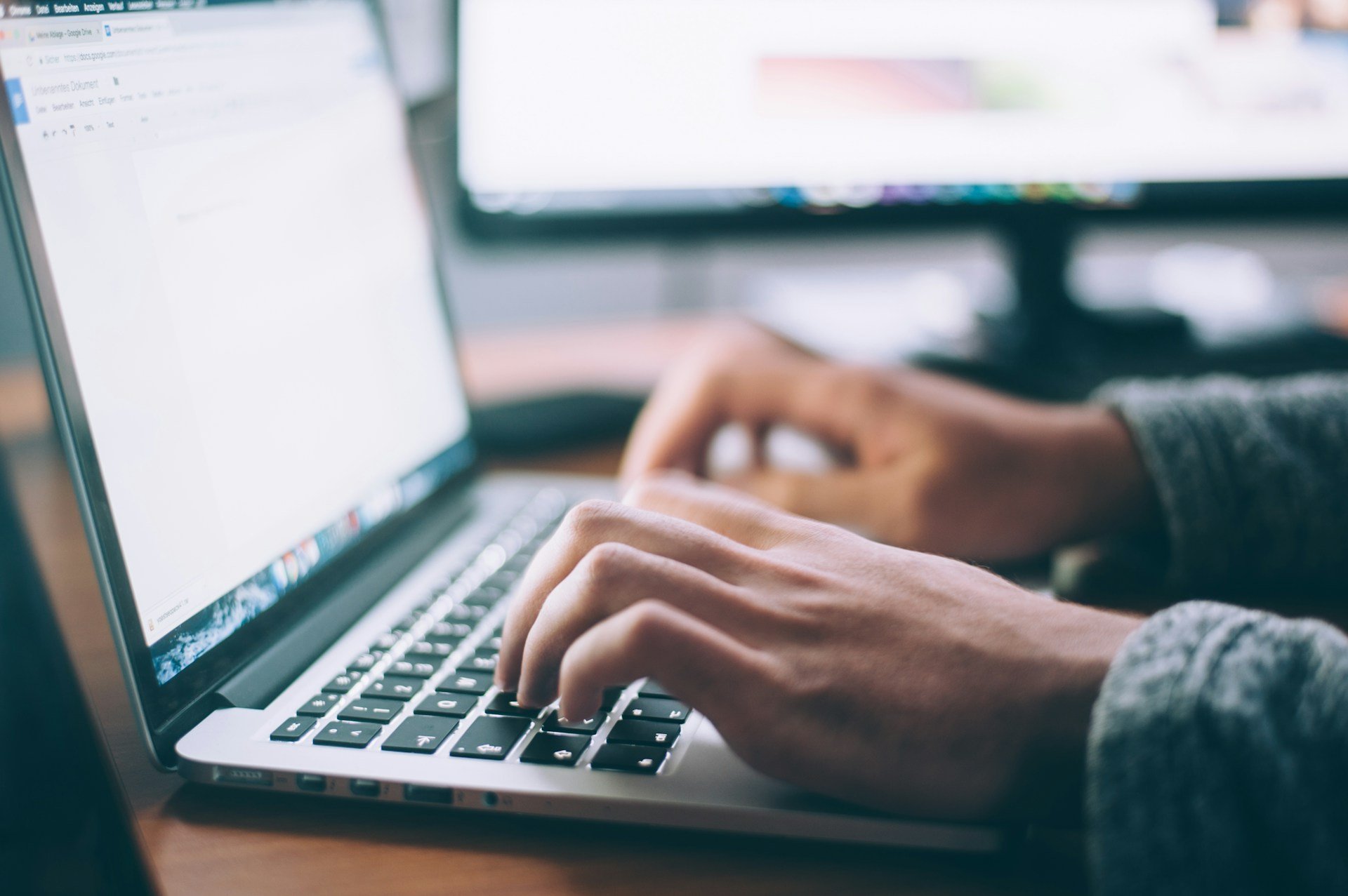 A man works on a laptop