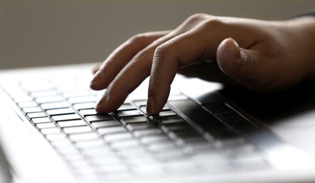 File photo shows a person typing on a keyboard.