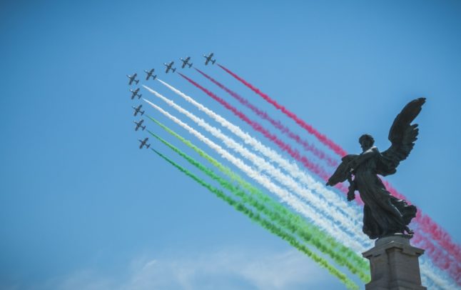 Frecce Tricolori jets perform a flyover over Rome