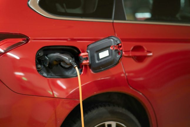 Pictured is an electric car being charged.