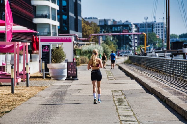 A jogger in the sun in Berlin.