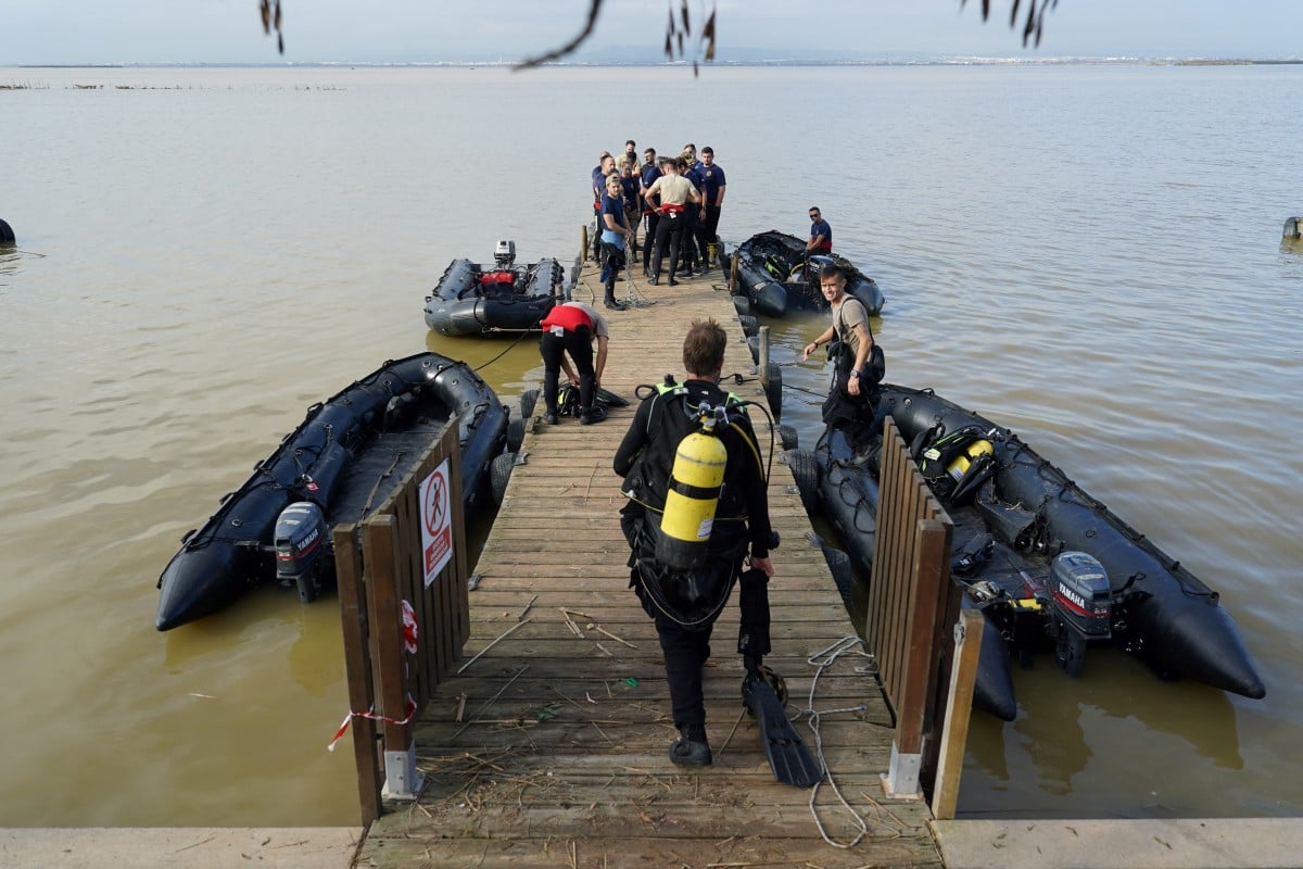 Spain's grim search for flood missing moves to coast