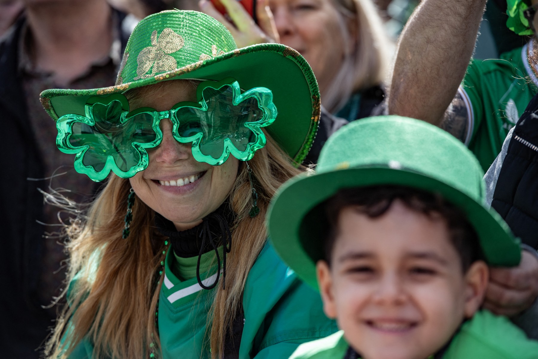 People watch a St Patrick's Day parade in Boston