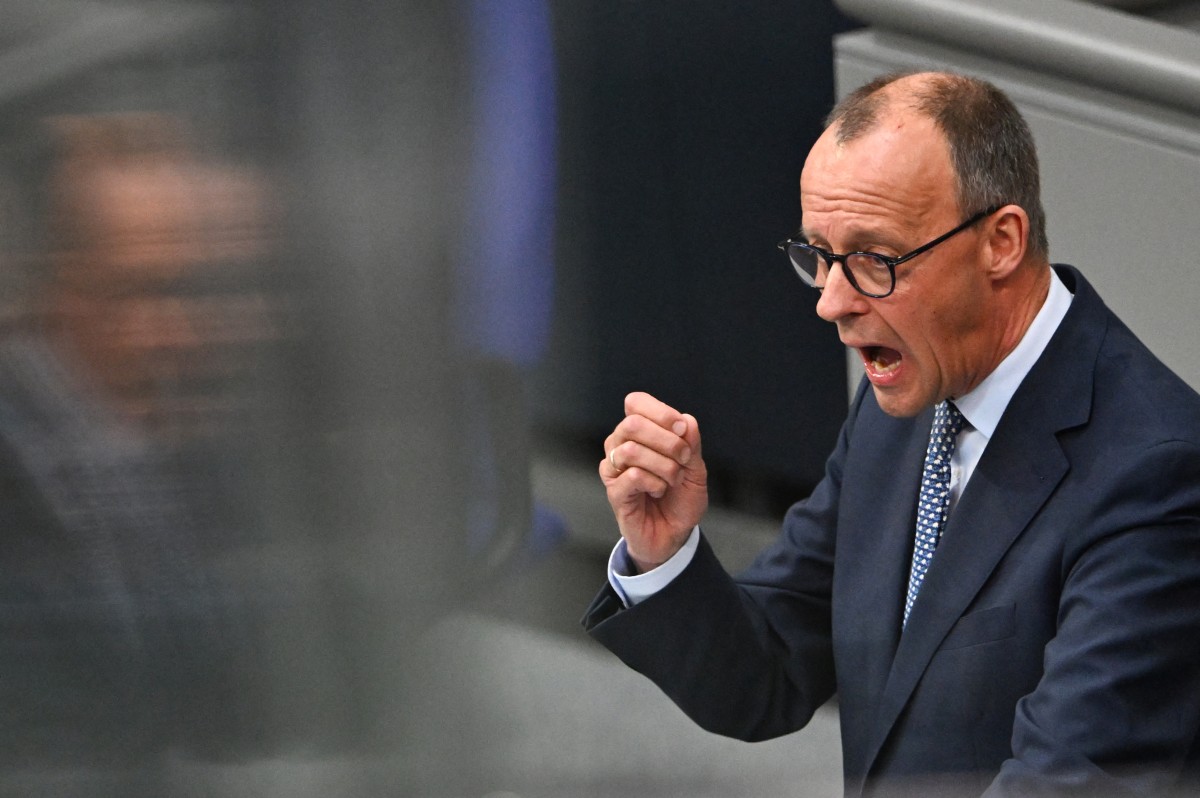 Germany’s Merz urges MPs to back spending bonanza in fiery debate