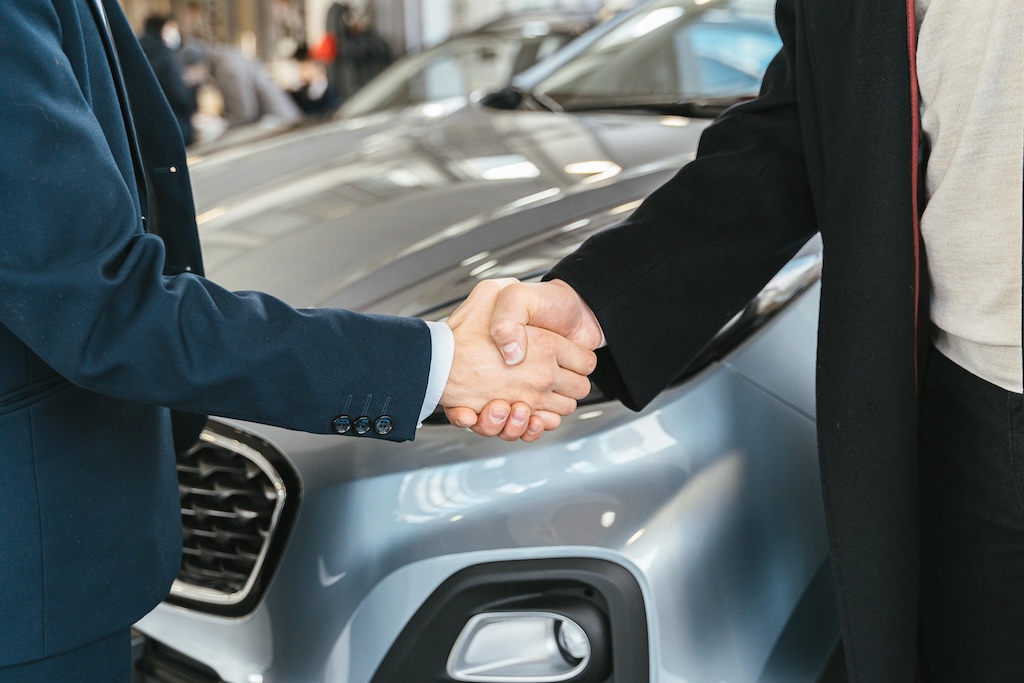 What taxes and fees do I have to pay when selling my car in Spain?