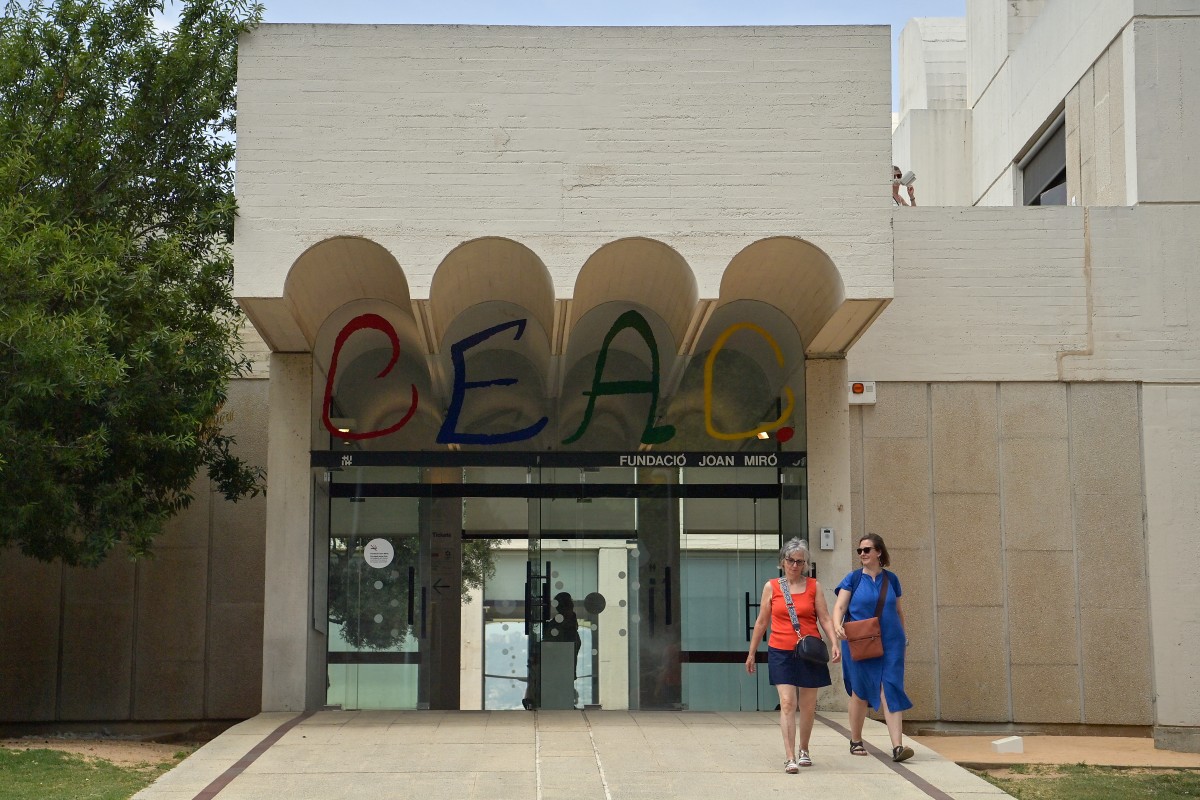 Two people exit the Fundacio Joan Miro art museum in Barcelona