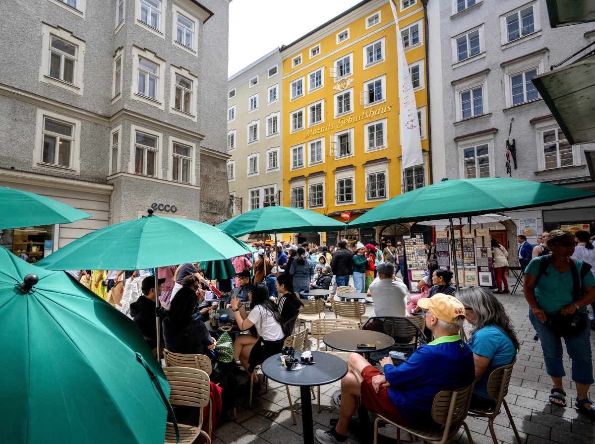 People at a cafe in Salzburg, Austria on April 16, 2025.