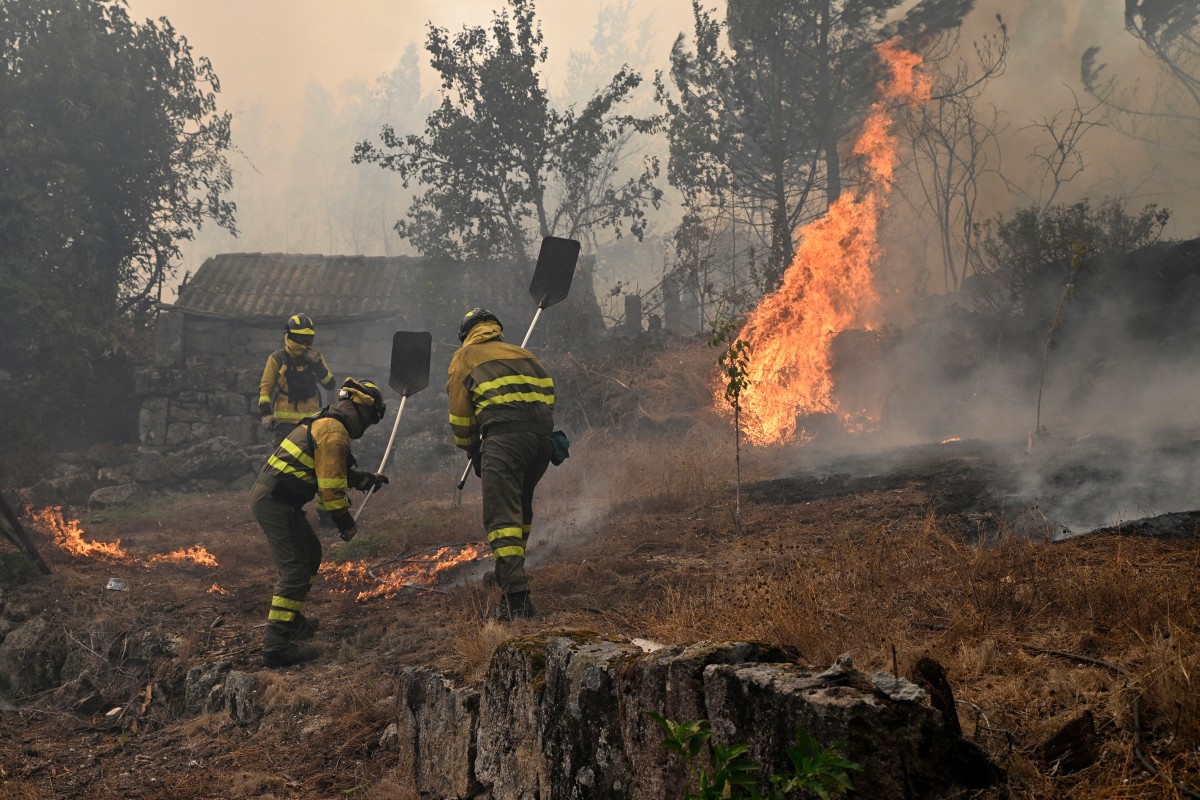 Firemen put out a fire in Spain