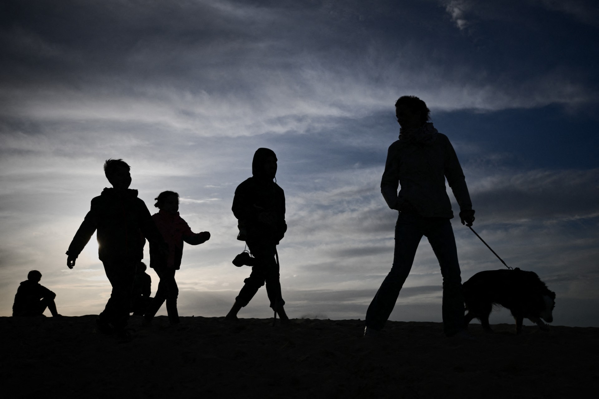 A family walk on the Dune of Pilat, the tallest sand dune in Europe, in Pyla-sur-Mer, La Teste-de-Buch, southwestern France
