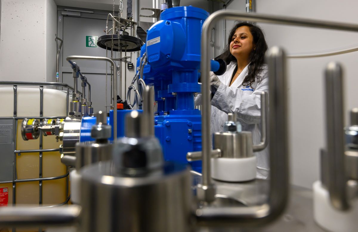 a woman in a lab coat at work in a laboratory