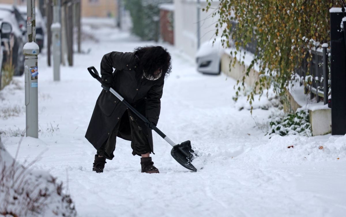 A woman shovels snow in Mecklenburg-Vorpommern on Monday November 24th 2025