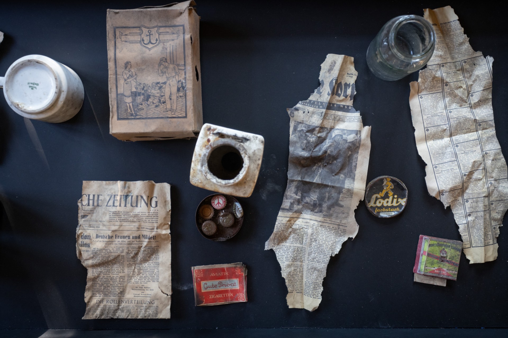 Artefacts from WWII are spread on a table.