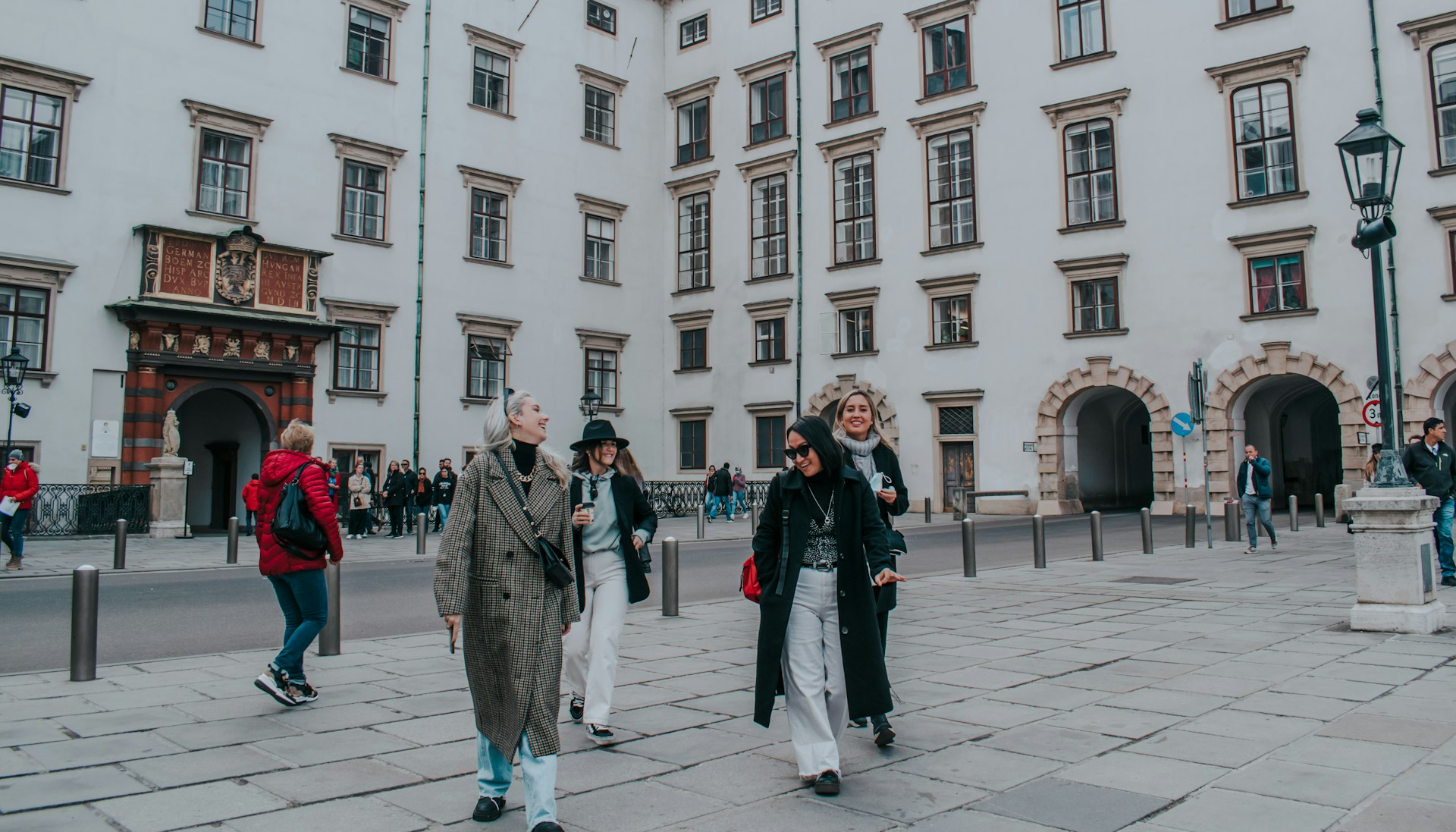 Friends laugh in Vienna.