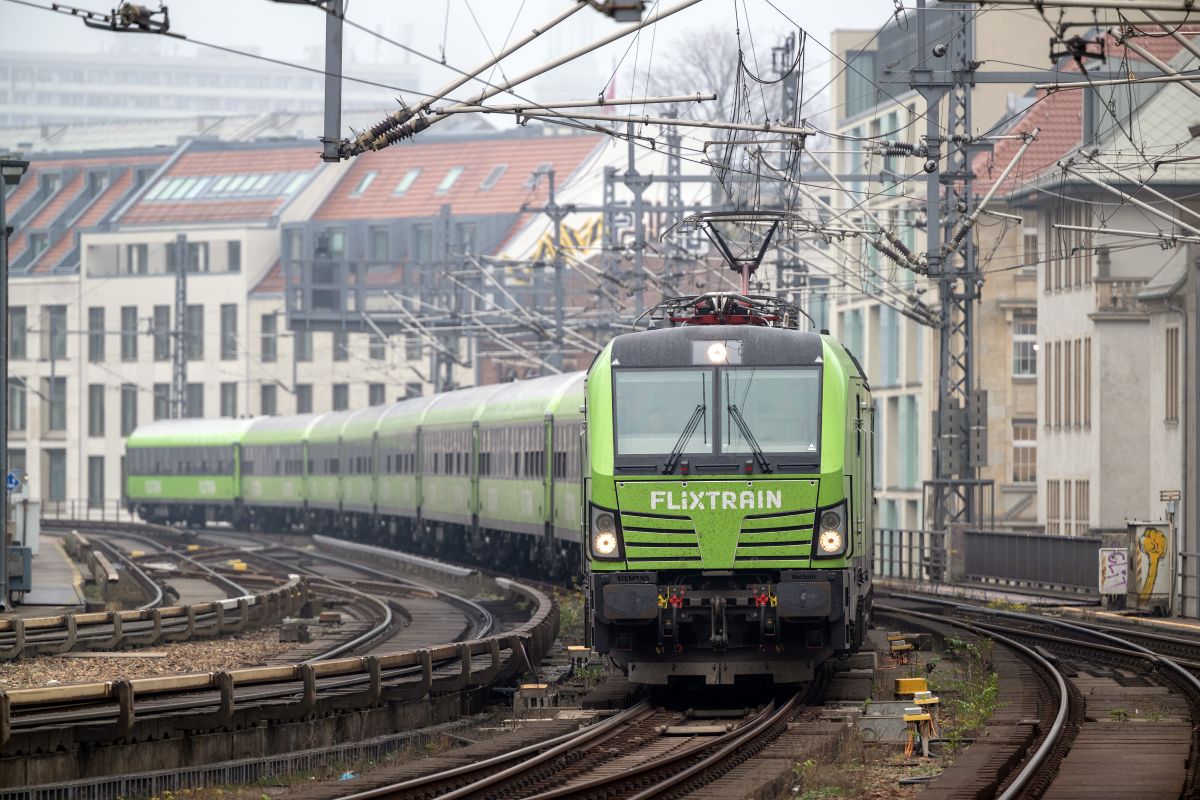 A train comes around the curve in a german city.