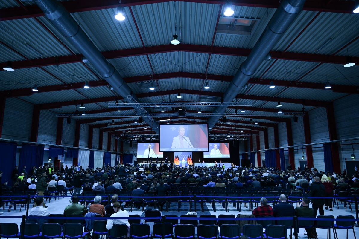 Empty seats are seen in the back rows as AfD co-leader Alice Weidel, seen on several large screens, delivers a speech during a two-day convention of far-right Alternative for Germany (AfD) party to establish its new youth organisation at the exhibition halls in Giessen, Germany on November 29, 2025.