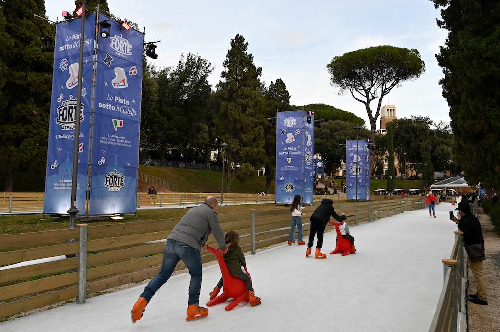 People ice skate at the Atreju festival in central Rome on December 7, 2025.