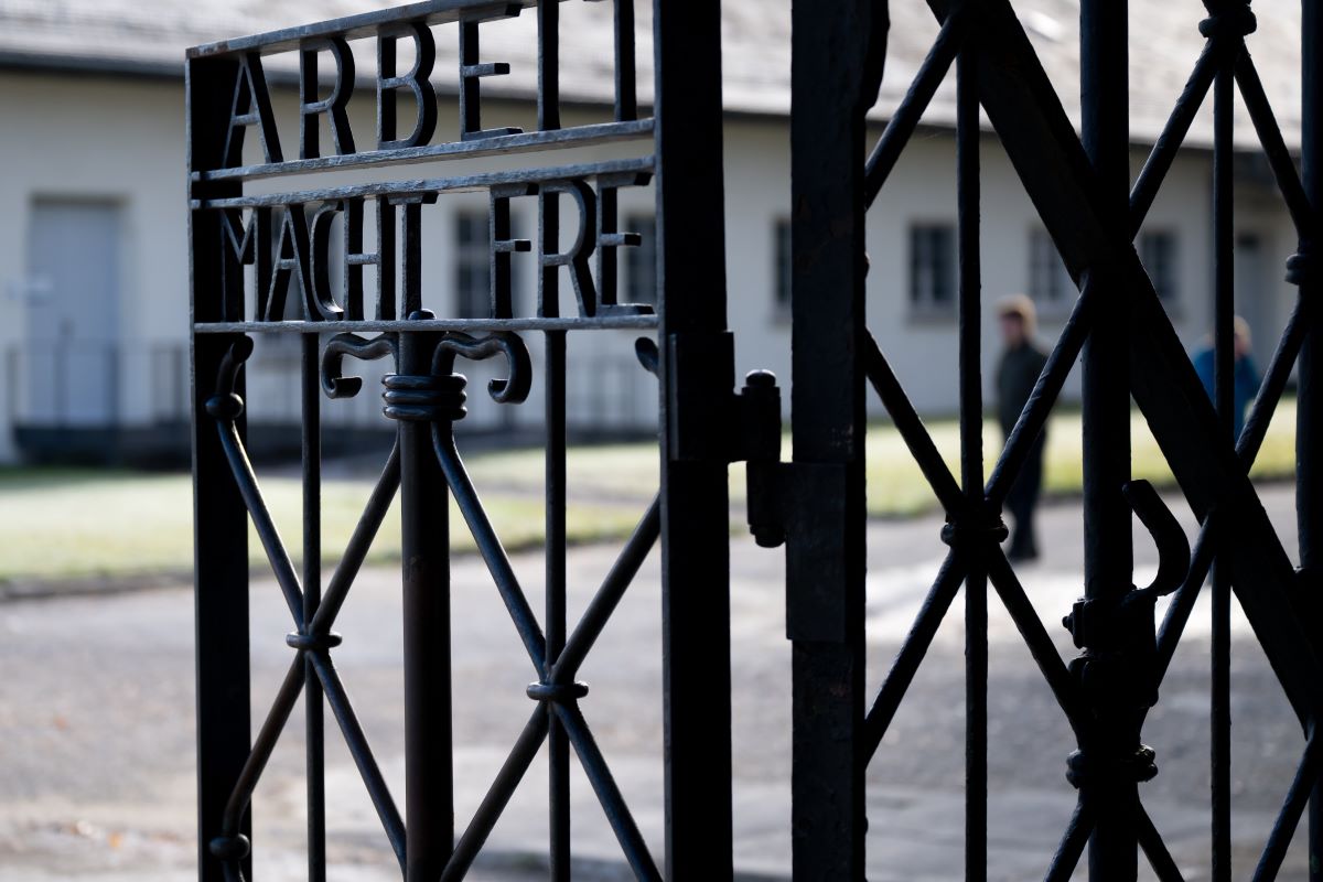 The entrance gate with the inscription “Arbeit macht frei” (Work makes you free) can be seen at the Dachau Concentration Camp Memorial Site.