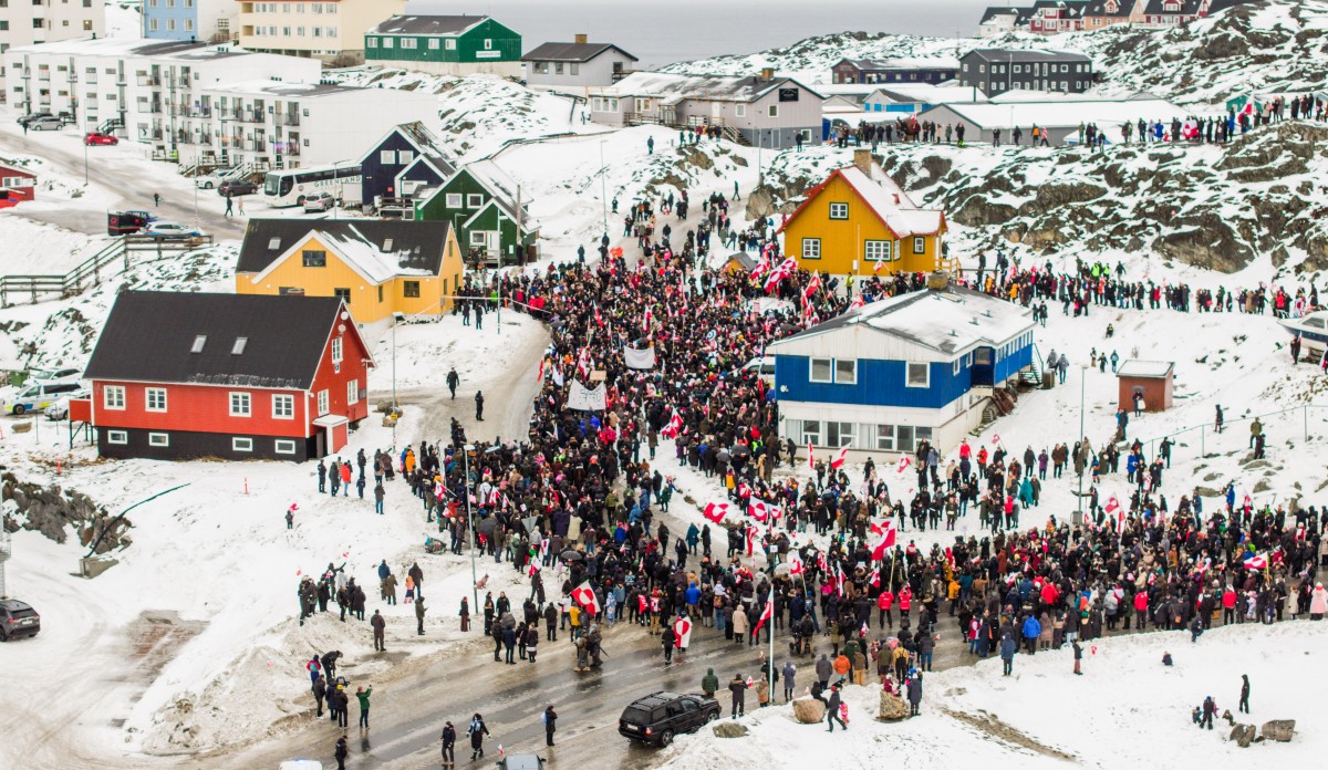 This aerial view taken by Mads Schmidt Rasmussen and handed out by Arctic Creative shows people as they take part in a demonstration that gathered almost a third of the city population to protest against the US President's plans to take Greenland, on January 17, 2026 in Nuuk, Greenland.