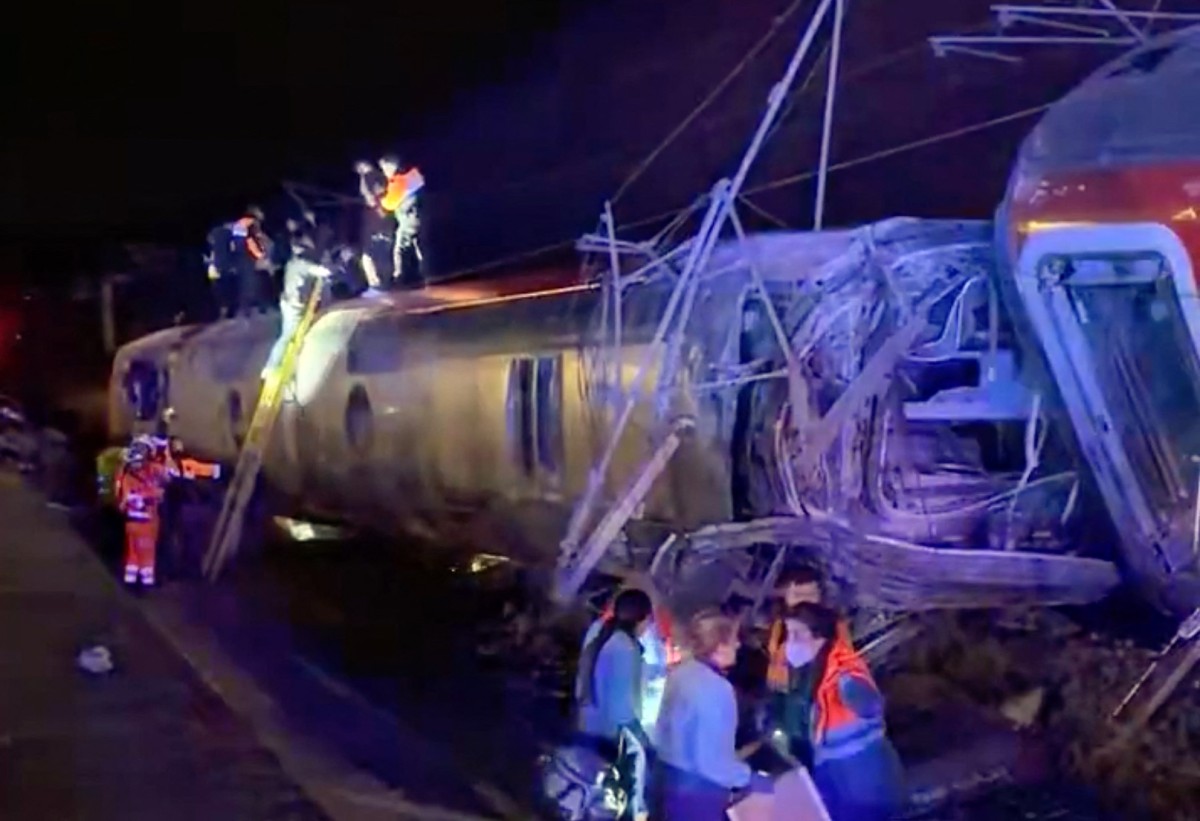 emergency personnel working after a train accident in Adamuz.