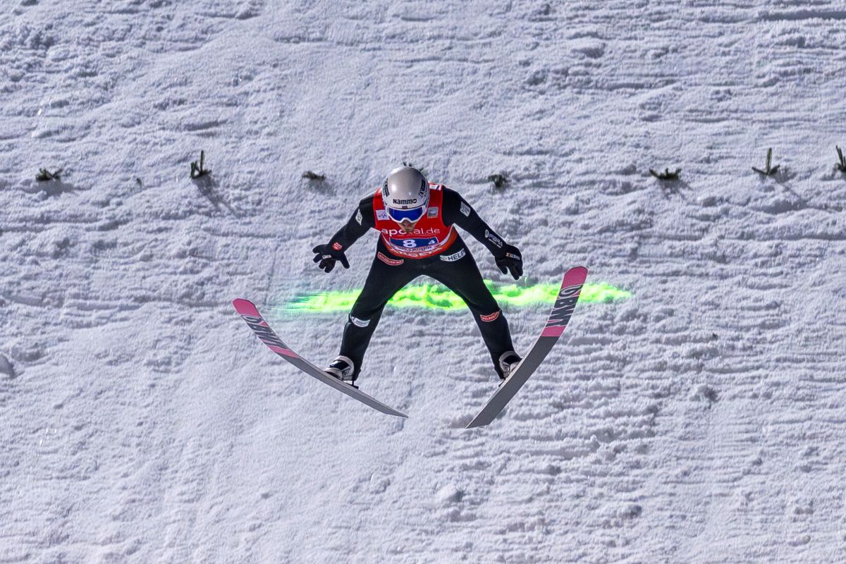 Nordic skiing/ski jumping: World Cup, team jumping, mixed, 2nd round: Johann Andre Forfang from Norway lands in the outrun and clearly jumps over the lead line.