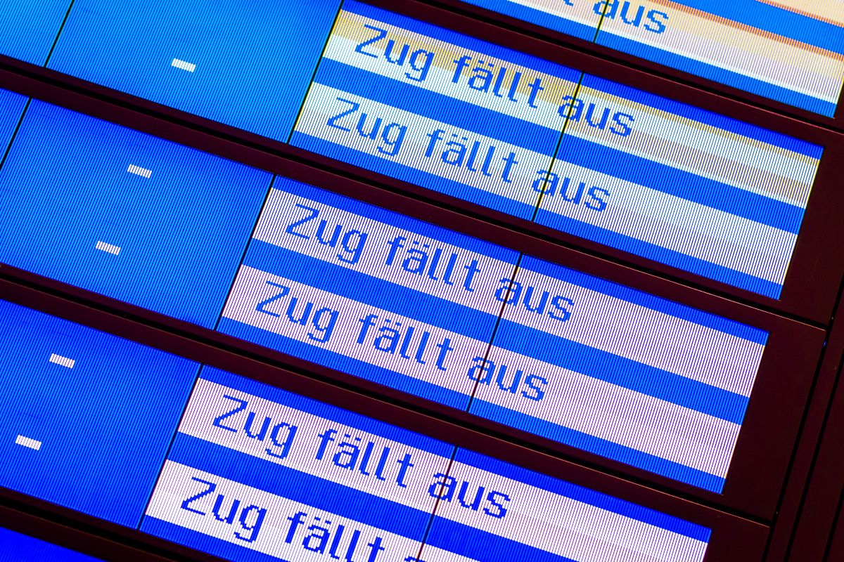 A schedule inside a train station shows that several trans are cancelled.